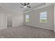 Spacious bedroom with carpet, ceiling fan, and walk-in closet at 58 Hillwood Dr, Sanford, NC 27332
