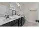 Double vanity bathroom with dark cabinets and tile floor at 58 Hillwood Dr, Sanford, NC 27332