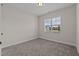 Bright bedroom with carpeted floor and window with blinds at 58 Hillwood Dr, Sanford, NC 27332