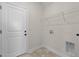 Laundry room with built-in shelving and tile flooring at 58 Hillwood Dr, Sanford, NC 27332