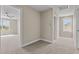 Bright hallway with carpet flooring, and doors leading to bedrooms and bathroom at 147 Hillwood Dr, Sanford, NC 27332