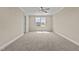 Well-lit bedroom featuring carpet floors and a ceiling fan at 147 Hillwood Dr, Sanford, NC 27332