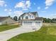 Two-story white house with a three-car garage at 147 Hillwood Dr, Sanford, NC 27332