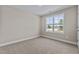 Bright bedroom featuring large window and carpet flooring at 147 Hillwood Dr, Sanford, NC 27332