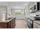 Modern kitchen with granite island and stainless steel appliances at 147 Hillwood Dr, Sanford, NC 27332
