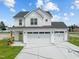 Two-story white house with a three-car garage at 147 Hillwood Dr, Sanford, NC 27332