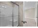 Bathroom with a shower stall and an additional room visible at 147 Hillwood Dr, Sanford, NC 27332