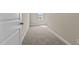 Carpeted hallway with neutral walls and natural light at 147 Hillwood Dr, Sanford, NC 27332