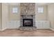 Stone fireplace with built-in cabinetry and hardwood floors at 147 Hillwood Dr, Sanford, NC 27332