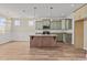 Modern kitchen with green cabinets, granite island, and stainless steel appliances at 147 Hillwood Dr, Sanford, NC 27332
