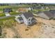 Aerial view of a two-story house on a new development street at 147 Hillwood Dr, Sanford, NC 27332