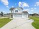 Two-story white house with a three-car garage at 147 Hillwood Dr, Sanford, NC 27332