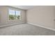 Spacious bedroom with large window and carpet flooring at 147 Hillwood Dr, Sanford, NC 27332
