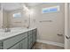 Bathroom boasts a double vanity, tiled floors and a window at 147 Hillwood Dr, Sanford, NC 27332