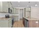 Modern kitchen with green cabinets and granite countertops at 147 Hillwood Dr, Sanford, NC 27332