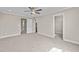 Bedroom with carpet, ceiling fan, and access to hallway and closet at 147 Hillwood Dr, Sanford, NC 27332