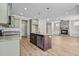 Open concept kitchen with island and a view into the living room at 147 Hillwood Dr, Sanford, NC 27332