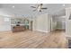 Open concept kitchen with an island, hardwood floors, and stainless steel appliances at 147 Hillwood Dr, Sanford, NC 27332