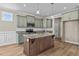 Kitchen island with granite countertop and dark wood cabinets at 147 Hillwood Dr, Sanford, NC 27332