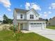 Two-story farmhouse style house with a double garage at 147 Hillwood Dr, Sanford, NC 27332
