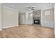 Open living room featuring hardwood floors and a stone fireplace at 147 Hillwood Dr, Sanford, NC 27332