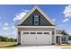 Two-car garage with gray and beige siding at 50 Oleander Ln, Sanford, NC 27332