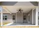 Covered patio with ceiling fan and access to the house at 50 Oleander Ln, Sanford, NC 27332