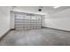 Spacious garage interior with concrete flooring and overhead storage at 50 Oleander Ln, Sanford, NC 27332