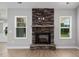 Close-up view of a rustic stone fireplace at 50 Oleander Ln, Sanford, NC 27332