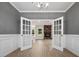 Open dining room with French doors leading to the living area at 50 Oleander Ln, Sanford, NC 27332