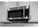 Stainless steel microwave installed above the stovetop at 50 Oleander Ln, Sanford, NC 27332