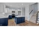 Modern kitchen with white and blue cabinets and a large island at 83 Oleander Ln, Sanford, NC 27332