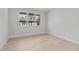 Light-filled bedroom featuring hardwood floors and large window at 1435 Duplin Rd, Raleigh, NC 27607