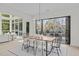 Open concept dining room with a view to the living room and access to deck at 1435 Duplin Rd, Raleigh, NC 27607