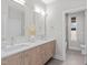 Modern bathroom with double vanity and updated fixtures at 1435 Duplin Rd, Raleigh, NC 27607