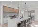 Modern kitchen with white cabinets, quartz countertops and stainless steel appliances at 1435 Duplin Rd, Raleigh, NC 27607