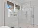 Luxurious shower with glass enclosure and modern fixtures at 1435 Duplin Rd, Raleigh, NC 27607