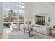 Bright living room with high ceilings and a view of the backyard at 1435 Duplin Rd, Raleigh, NC 27607