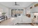 Main bedroom with light flooring and private balcony access at 1435 Duplin Rd, Raleigh, NC 27607