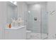 Modern bathroom with walk-in shower and white vanity at 1435 Duplin Rd, Raleigh, NC 27607