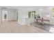 Light-filled hallway with hardwood floors and access to bedrooms at 1435 Duplin Rd, Raleigh, NC 27607