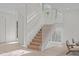 Modern staircase with a sleek, minimalist design and natural wood at 1435 Duplin Rd, Raleigh, NC 27607