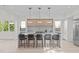 Modern kitchen with white cabinets, quartz countertops, and island seating at 1435 Duplin Rd, Raleigh, NC 27607