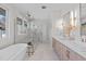 Spa-like bathroom with double vanity and soaking tub at 1435 Duplin Rd, Raleigh, NC 27607