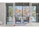 Private screened balcony with two chairs and a side table at 1435 Duplin Rd, Raleigh, NC 27607