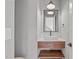 Modern powder room with floating vanity and sleek mirror at 1439 Duplin Rd, Raleigh, NC 27607