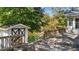 Spacious deck overlooks a serene pond with a storage shed at 104 Lake Dr, Clayton, NC 27520