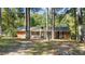 Brick ranch house with white accents and a large yard at 104 Lake Dr, Clayton, NC 27520