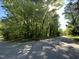 Wooded lot located on corner lot with paved road access at 5308 Parkwood Dr, Raleigh, NC 27612