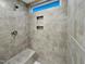 Spacious shower with built-in seat and tiled walls at 127 Sugar Run Dr # 27, Fuquay Varina, NC 27526